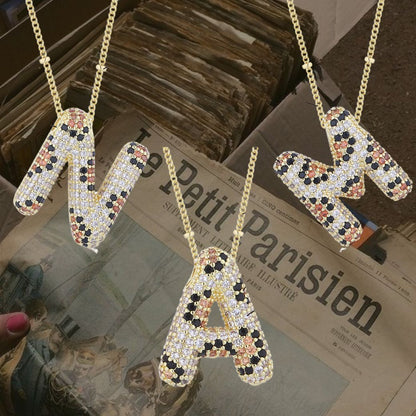 Leopard initial necklace - 𝐇𝐨𝐧𝐞𝐲 𝐁𝐮𝐭𝐭𝐞𝐫 𝐍𝐢𝐧𝐞